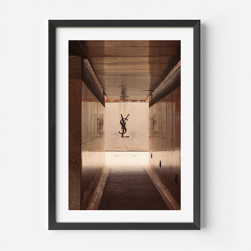 Framed photograph of a hallway with a logo on the wall