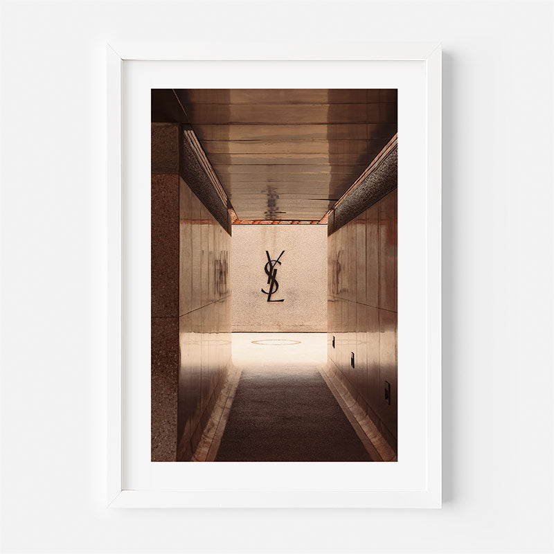 Framed photograph of a hallway with a logo on the wall