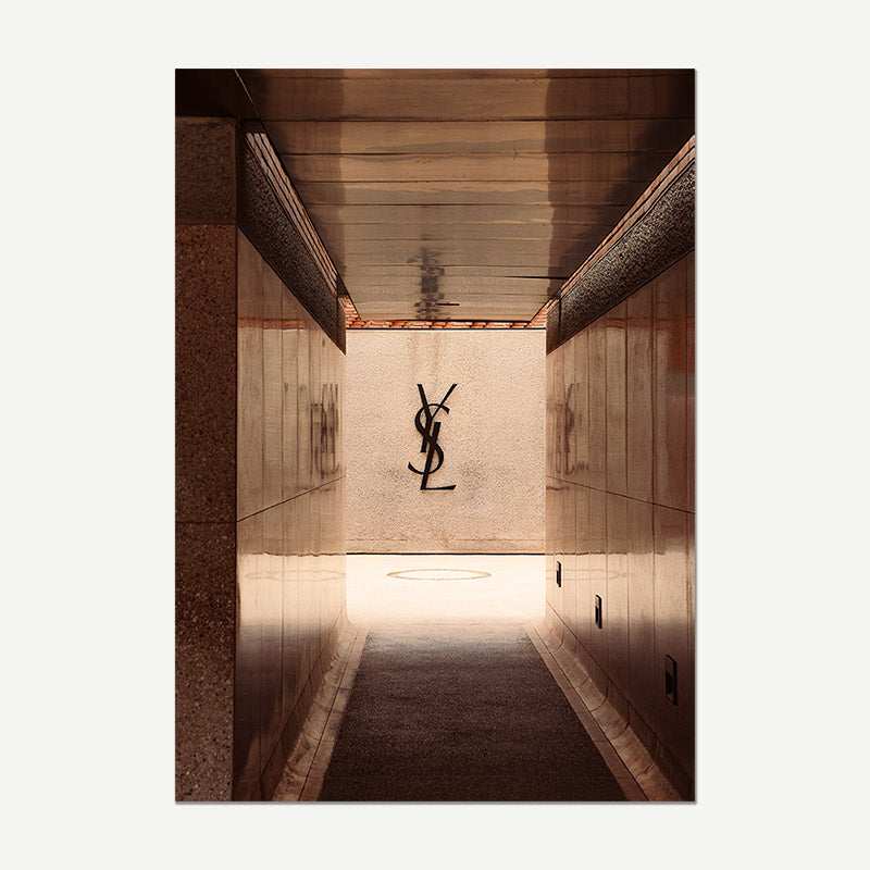 Museum hallway with Yves Saint Laurent logo on a wall