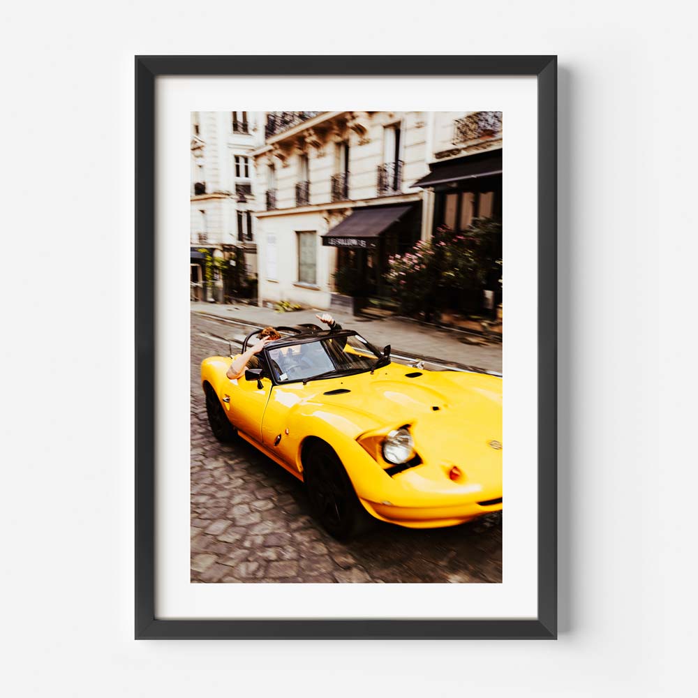 Parisian street with yellow sport car in original photography, perfect for home decor and stylish interiors.