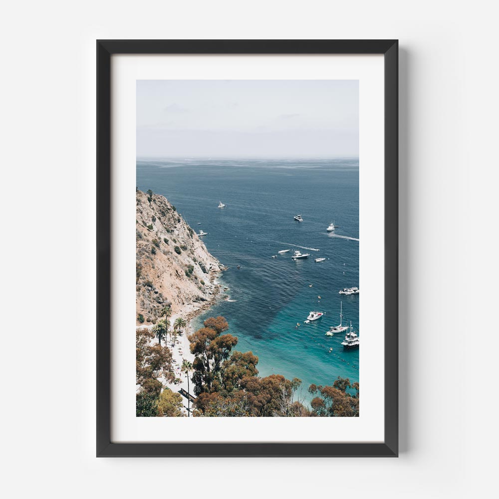 Beach scene wall art featuring boats anchored in the bay, with sunbathers enjoying summer in California.