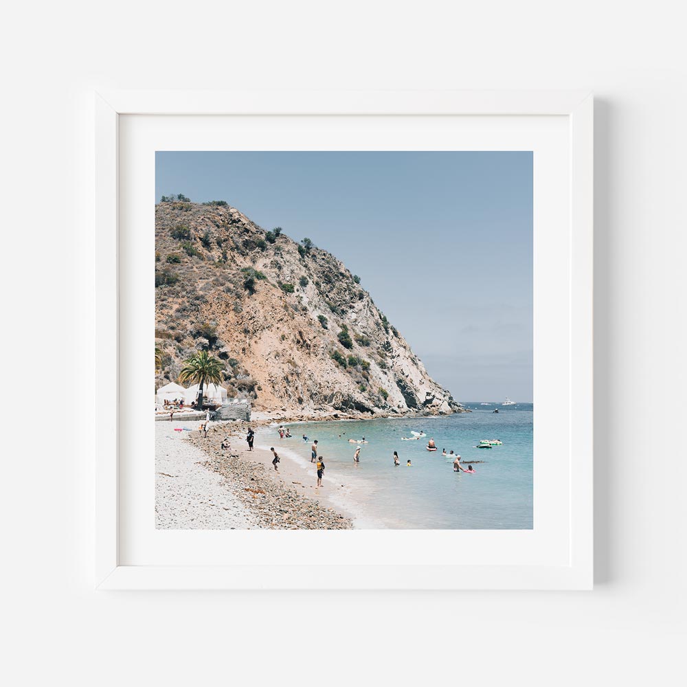 Descanso Beach wall art with swimmers and mountain view.