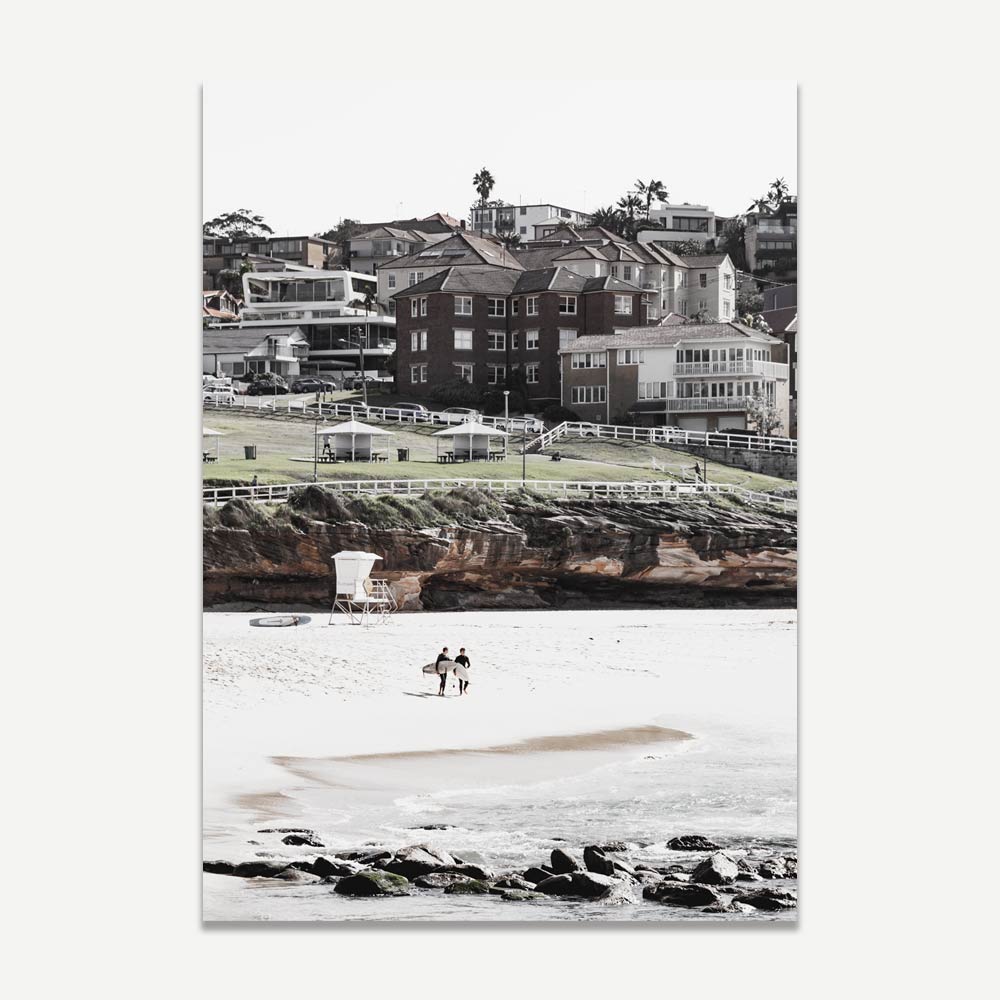A black and white art print of Bronte beach featuring the rugged shoreline, residential hillsides, and the famous ocean rock pool.