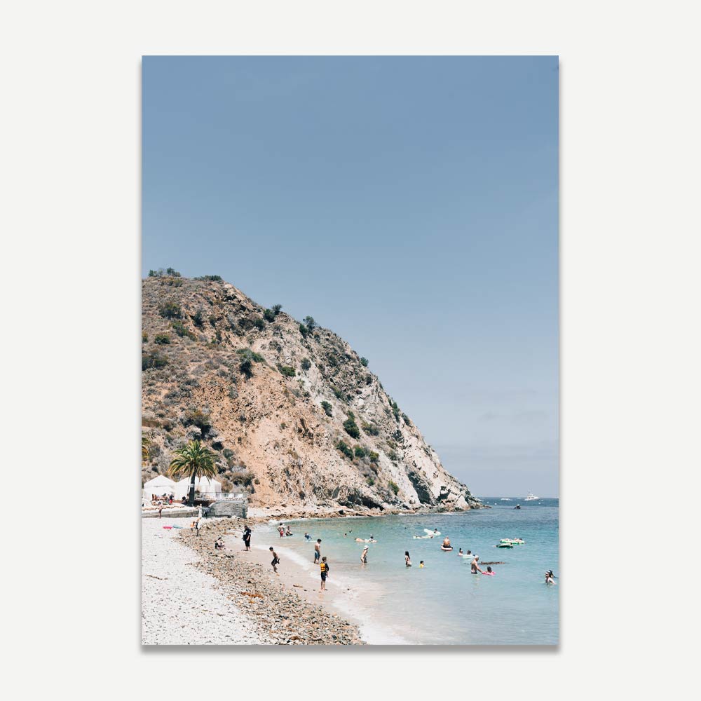 OblongShop's wall artwork of Descanso Beach Club, highlighting the bustling beach and harbor teeming with boats and beachgoers.