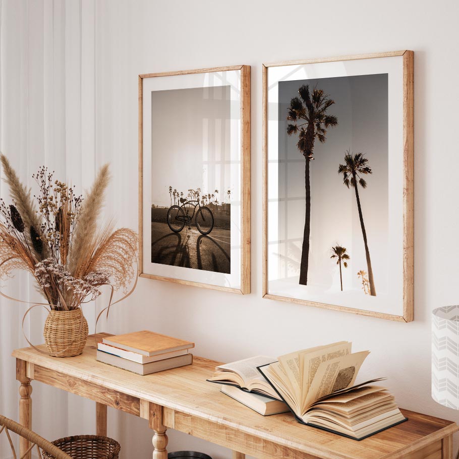 Wall art featuring a framed photo of a bicycle in California with sunlight streaming through.