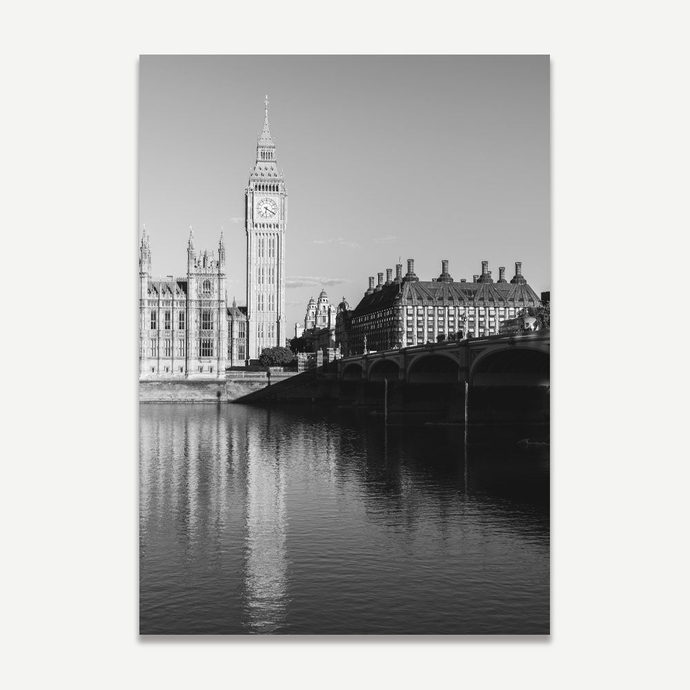 Black and white photograph of Westminster Abbey and Big Ben with the River Thames in the foreground.