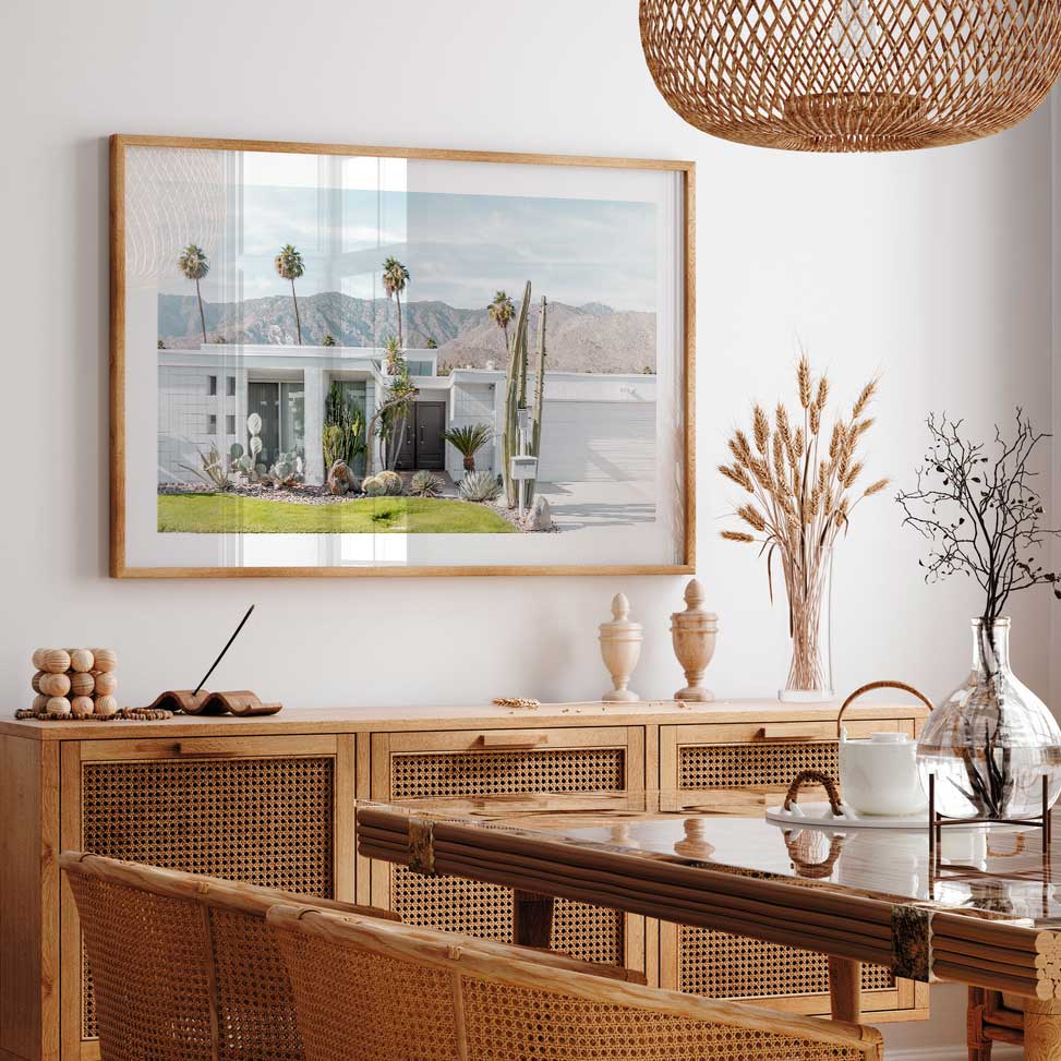 Midcentury home in Palm Springs with black door wall art from OblongShop, adding retro charm.