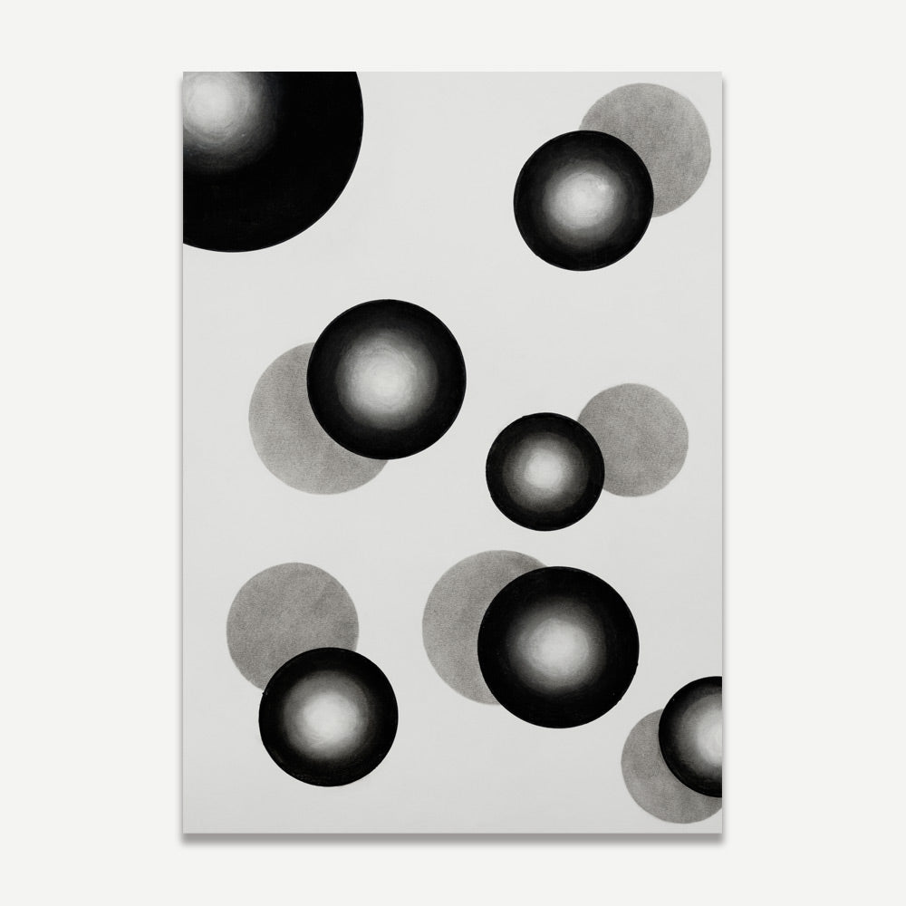 A black and white photograph of abstract circular patterns on a wall.