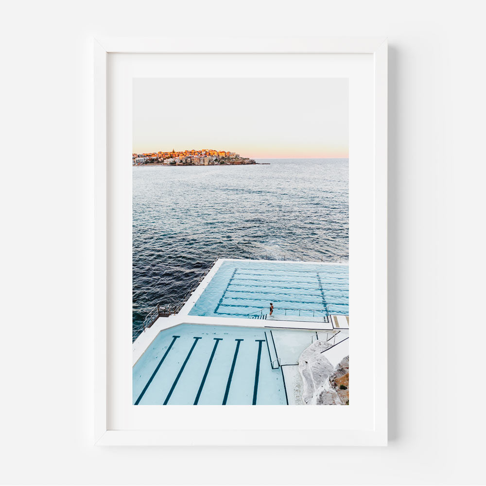 Framed coastal wall art showcasing a peaceful evening glow over Australia’s iconic oceanfront pool.