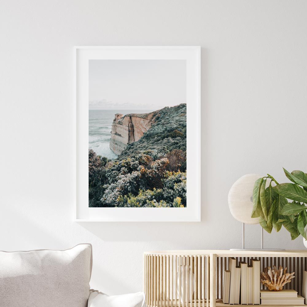 White framed Coastal wall art featuring Castle Rock along Victoria’s rugged Great Ocean Road at golden hour