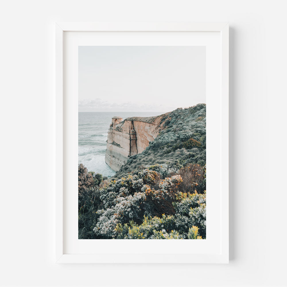 Framed coastal wall art showcasing bold cliffs and crashing waves near Castle Rock