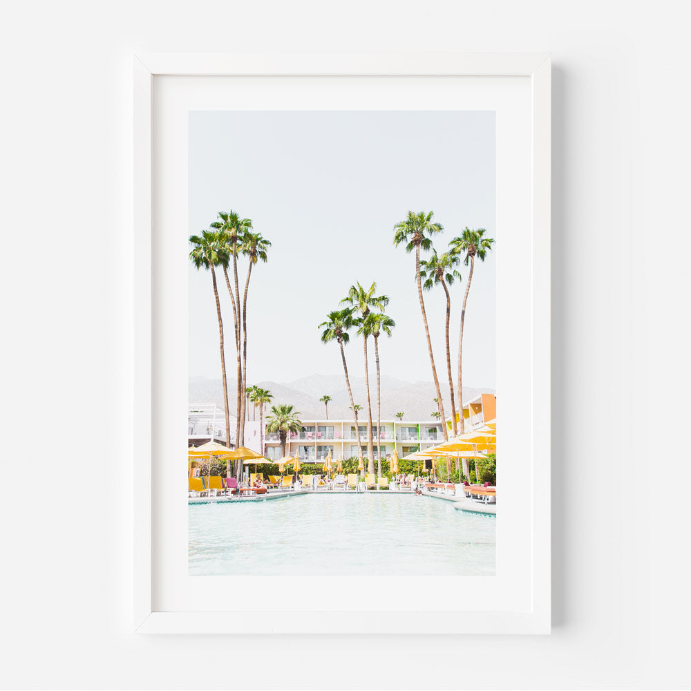 A white framed photo of palm trees and a pool at The Saguaro Hotel in Palm Springs - Oblongshop wall art