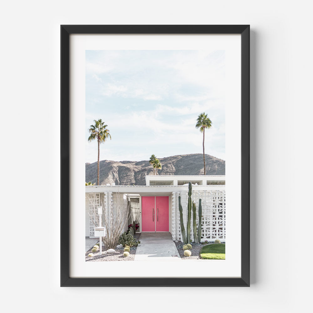 Palm Springs midcentury modern house with pink door, cactus, and mountains - great for living room wall art.