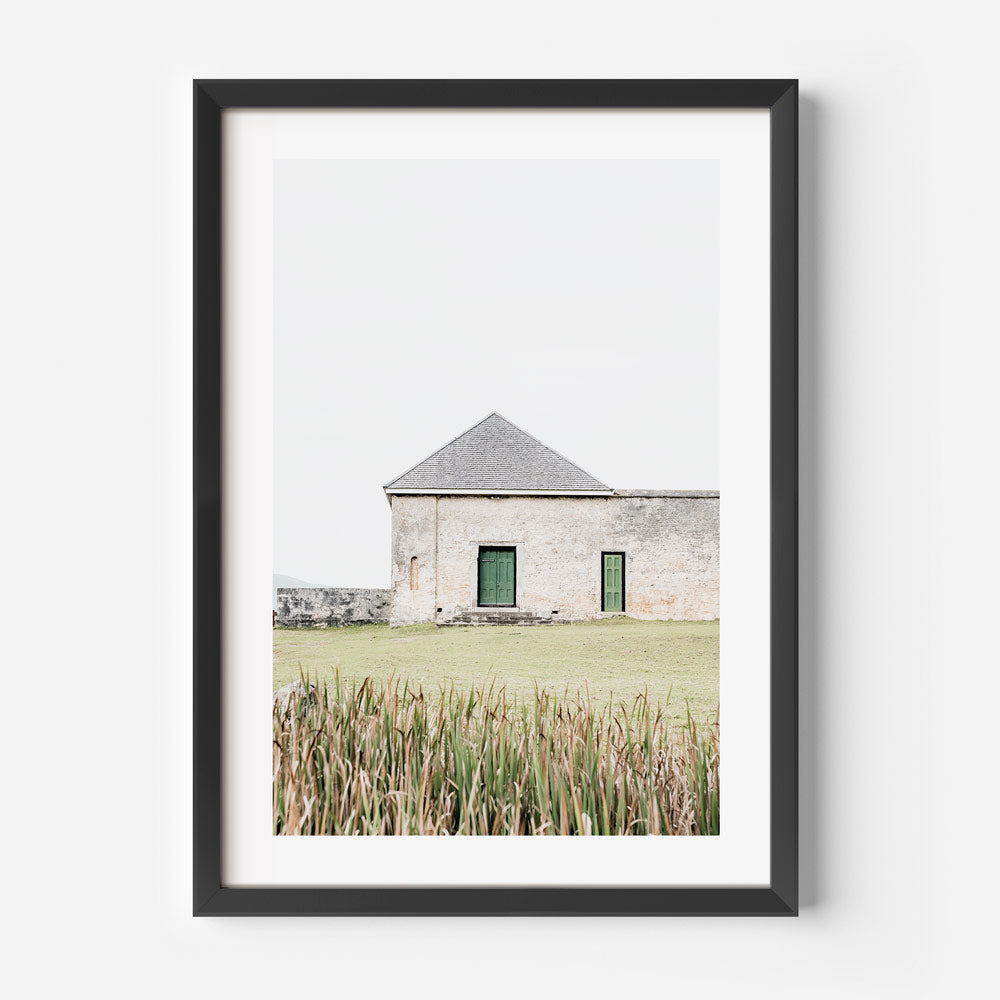 Wall art featuring a black framed photo of a building with green doors - Architecture on Norfolk Island