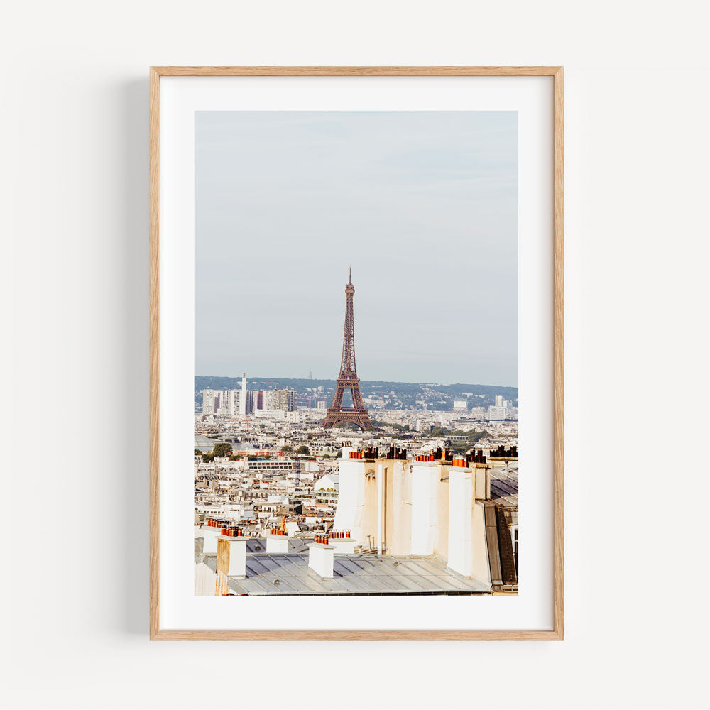 Montmartre's quiet charm captured in soft morning hues, featuring the Eiffel Tower and Parisian architecture.
