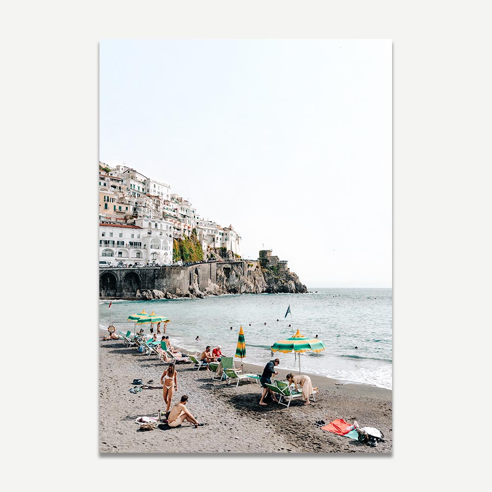 Home decor wall art of Amalfi beach with sunbathers, turquoise sea, golden sand, and cliffside backdrop