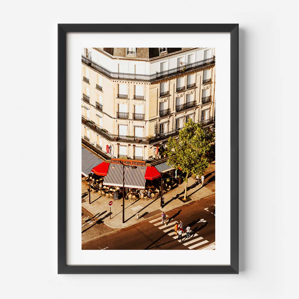 Timeless Paris café scene with sunlight in original photography, adding a chic touch to your interior decor.
