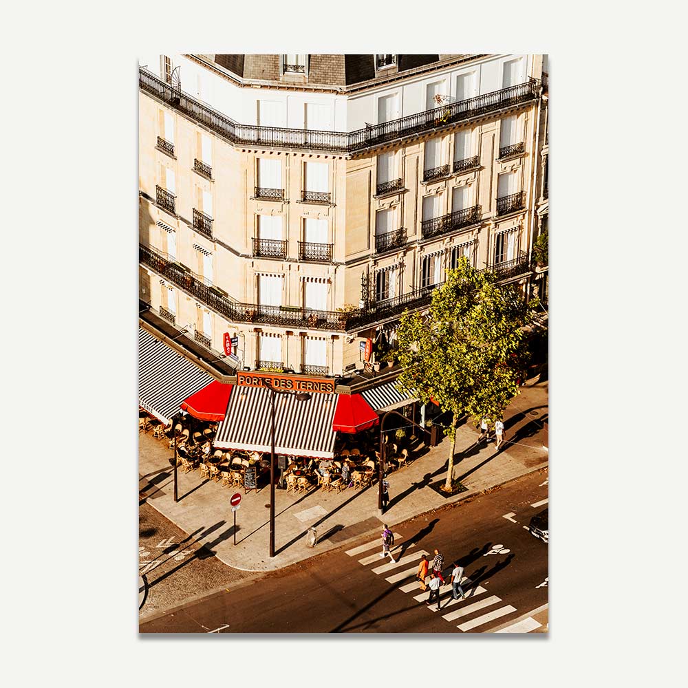 Afternoon sun casting a peaceful glow on café tables in Paris, ideal for home decor with a relaxed ambiance.
