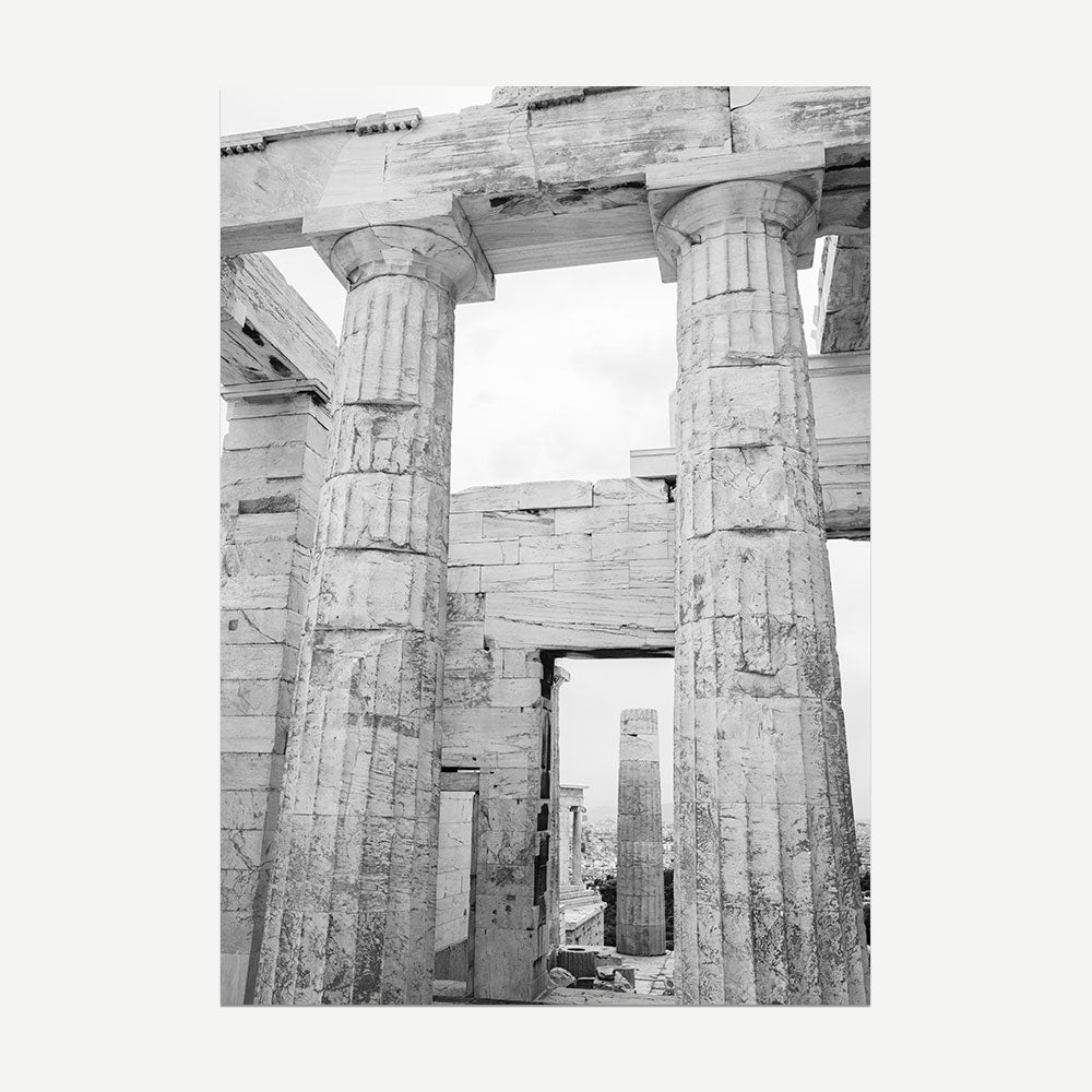 Black and white photograph of ancient temple ruins with columns.