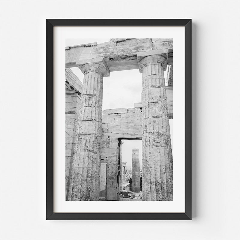Framed black and white photograph of ancient temple ruins with columns.
