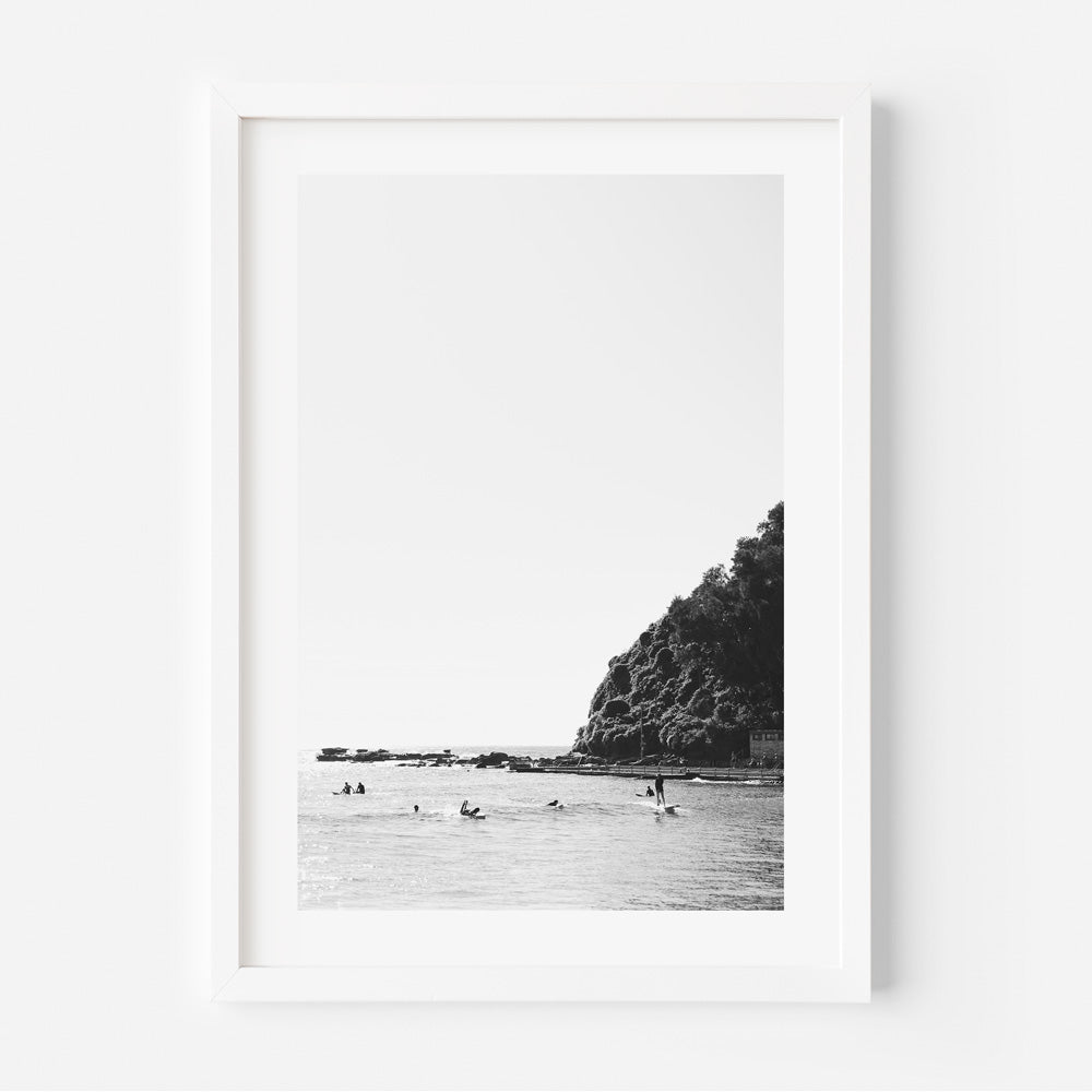 Breathtaking black and white image of surfers at Palm Beach, Australia - Perfect for wall art.