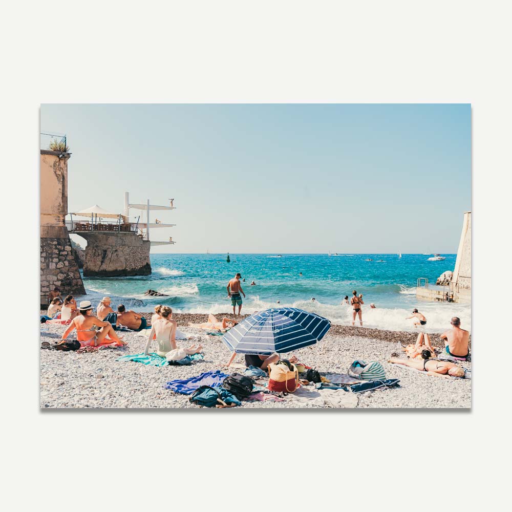 Été Print featuring a colourful beach scene in Nice, France with sunbathers and coastal scenery.