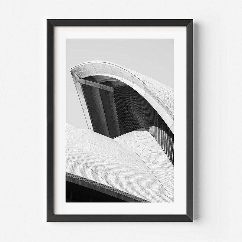 Framed black and white architectural print of a modern building on a white background