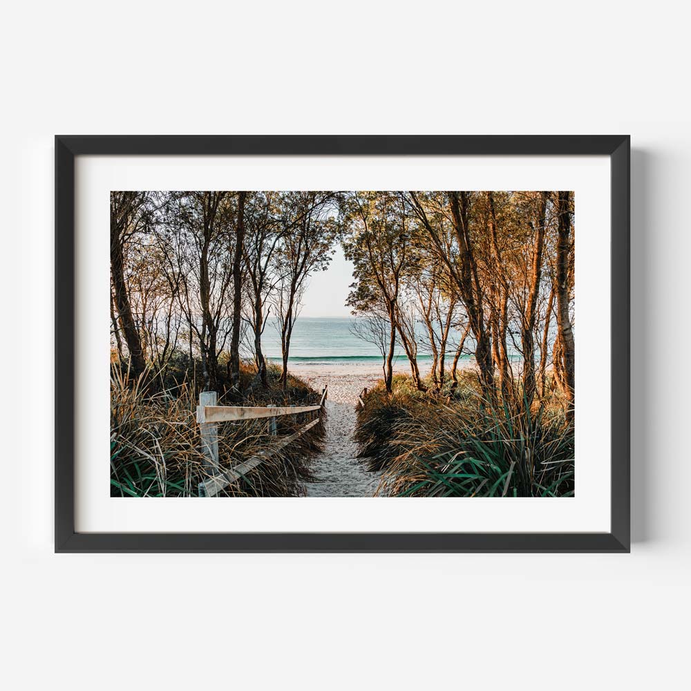 Large framed beach scene art featuring Australian coastline in warm sunrise tones for sophisticated decor

