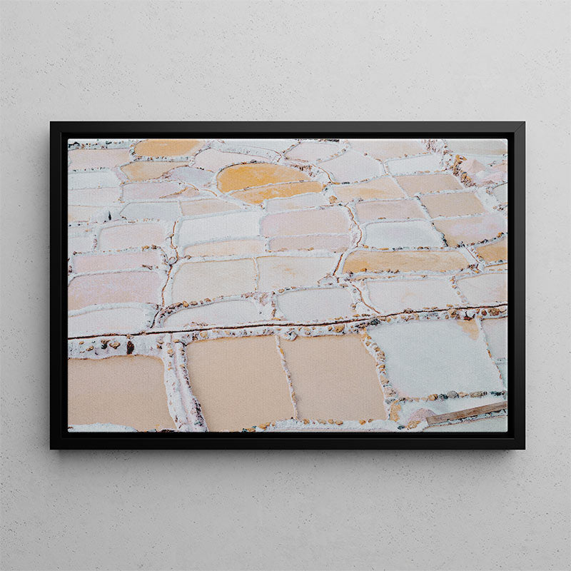 Framed artwork of a stone wall pattern on a gray wall