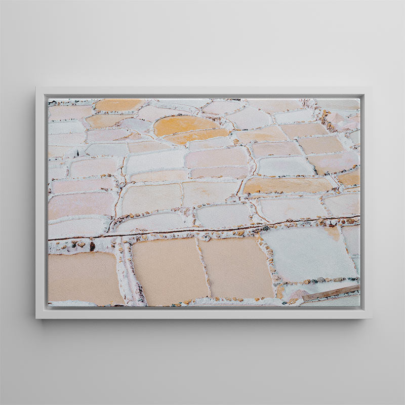 Framed abstract art with earthy tones on a gray wall