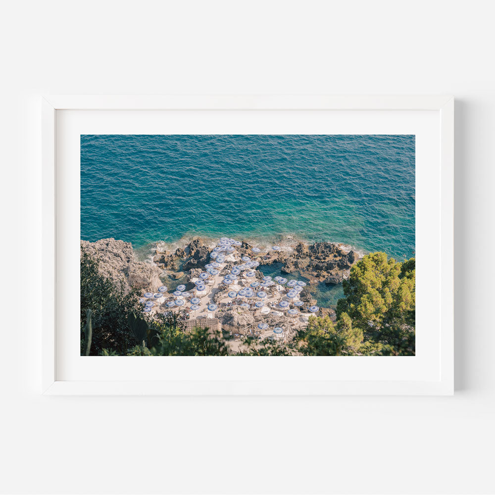 Transport yourself to the azure shores of La Fontelina, Capri, Italy, with this captivating canvas print capturing the essence of seaside luxury.