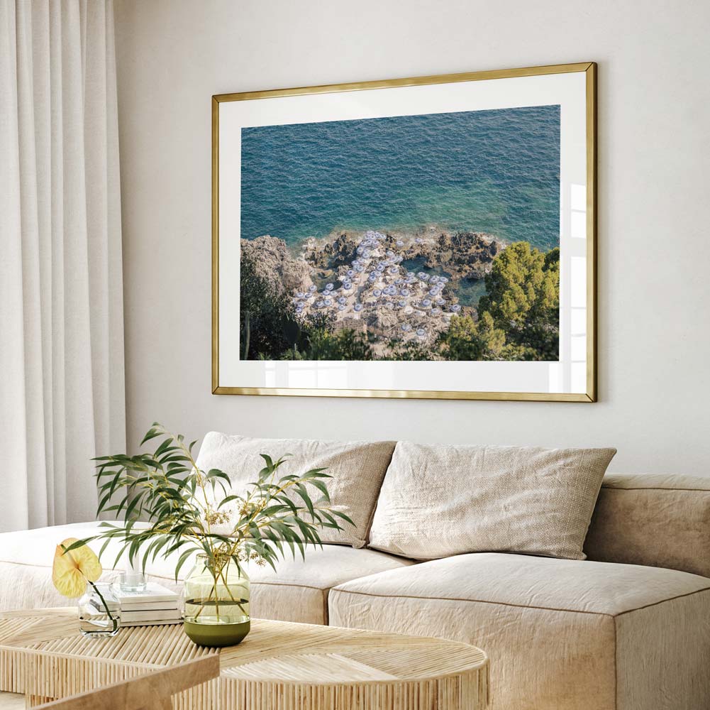  Immerse yourself in the beauty of Capri's coastline with this original photography print showcasing La Fontelina Beach Club, a timeless symbol of Mediterranean allure.