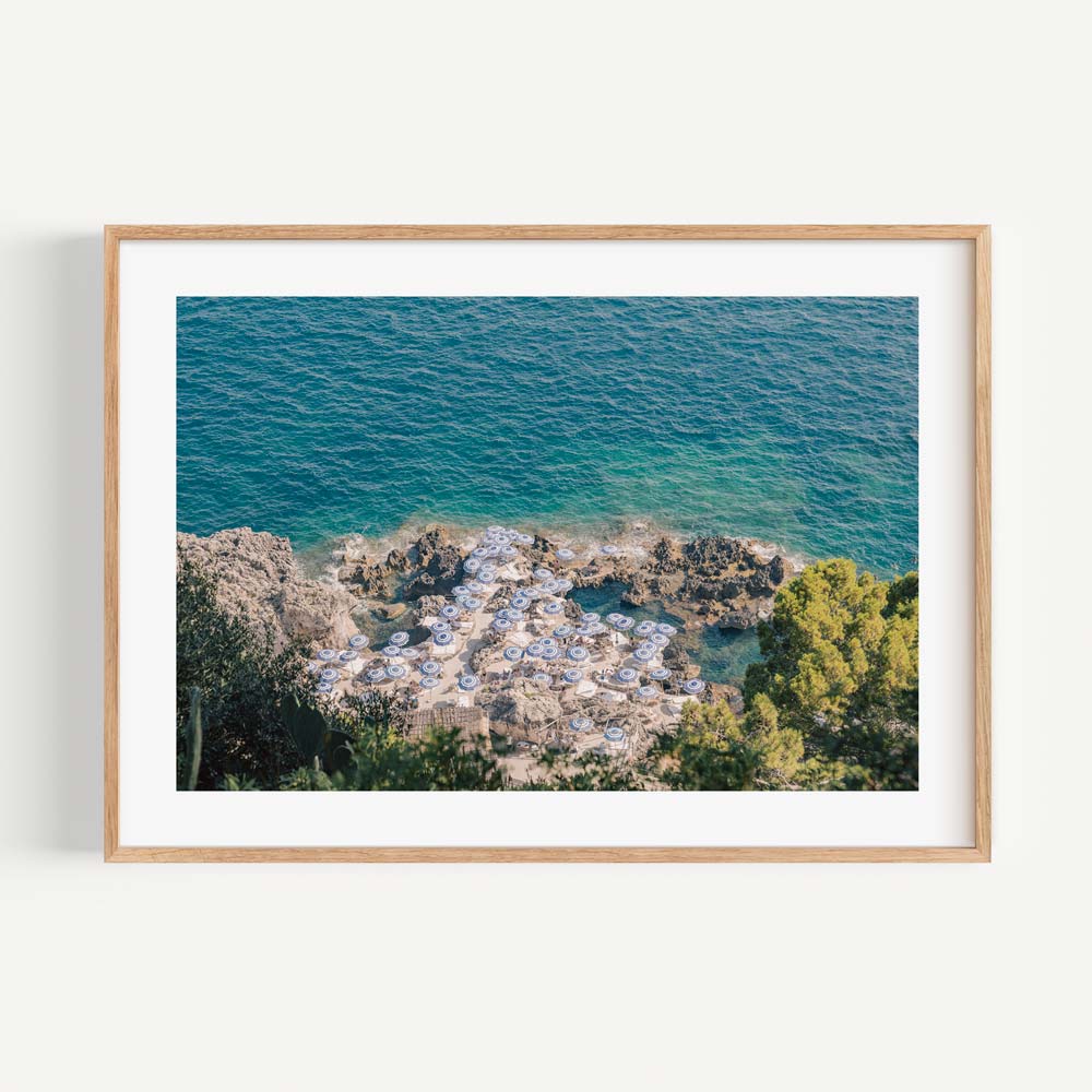  Experience the sophistication of Italian coastal living with this fine art print of La Fontelina Beach Club, meticulously crafted to evoke the charm of Capri.