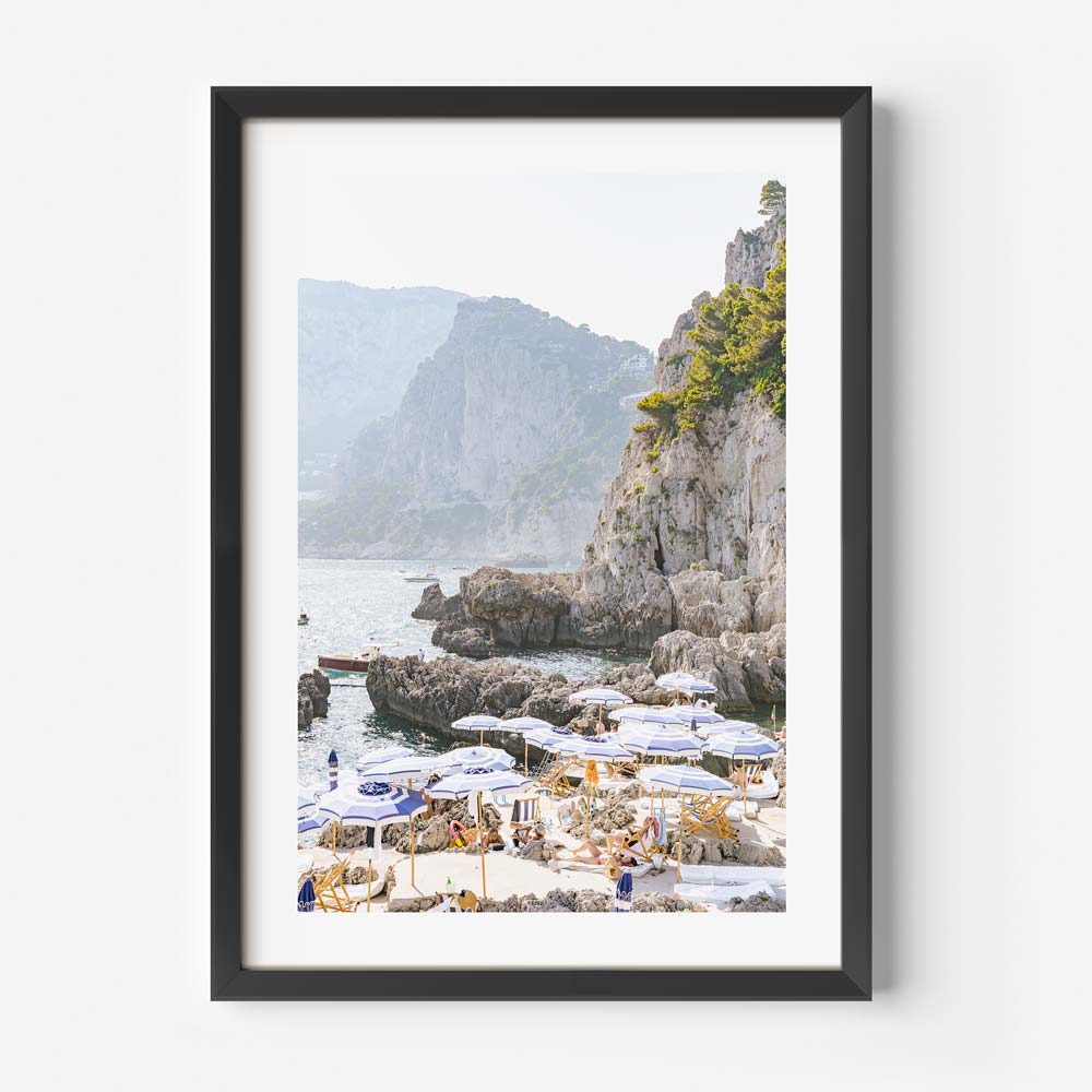 Discover the beauty of LA FONTELINA, CAPRI COAST, ITALY with Oblongshop's wall art - a white framed photo showcasing the beach and mountains