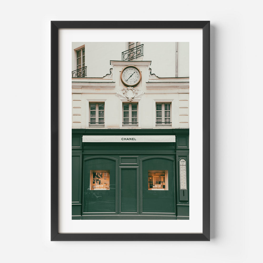 A stunning wall artwork of the Chanel building in Paris, France, with a clock, perfect for adding a touch of sophistication to your space.