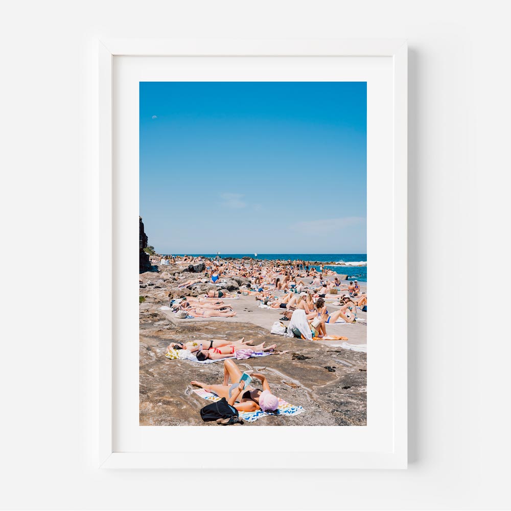Chapter V, Clovelly, Sydney: Relaxing beach scene with sunbathing people - Perfect for Home Decor and Wall Art by Oblongshop.
