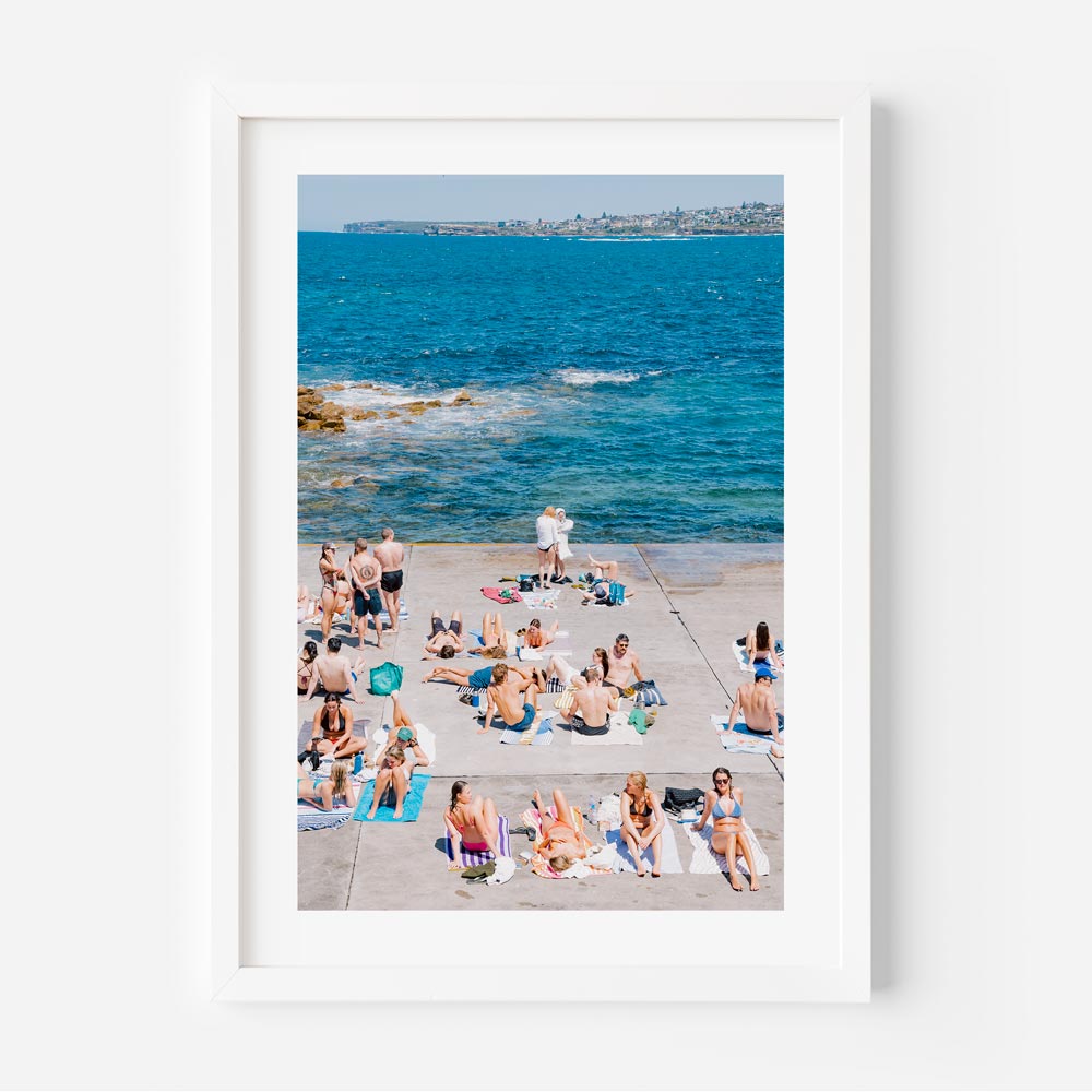 Sunny beach day at Clovelly, Sydney: People relaxing by the sea - Perfect for home decor and wall art.