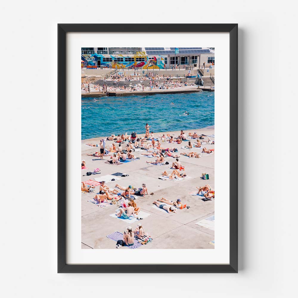Serene summer scene at Clovelly, Sydney: People relaxing by the sea - Enhance your home decor with this real photography.