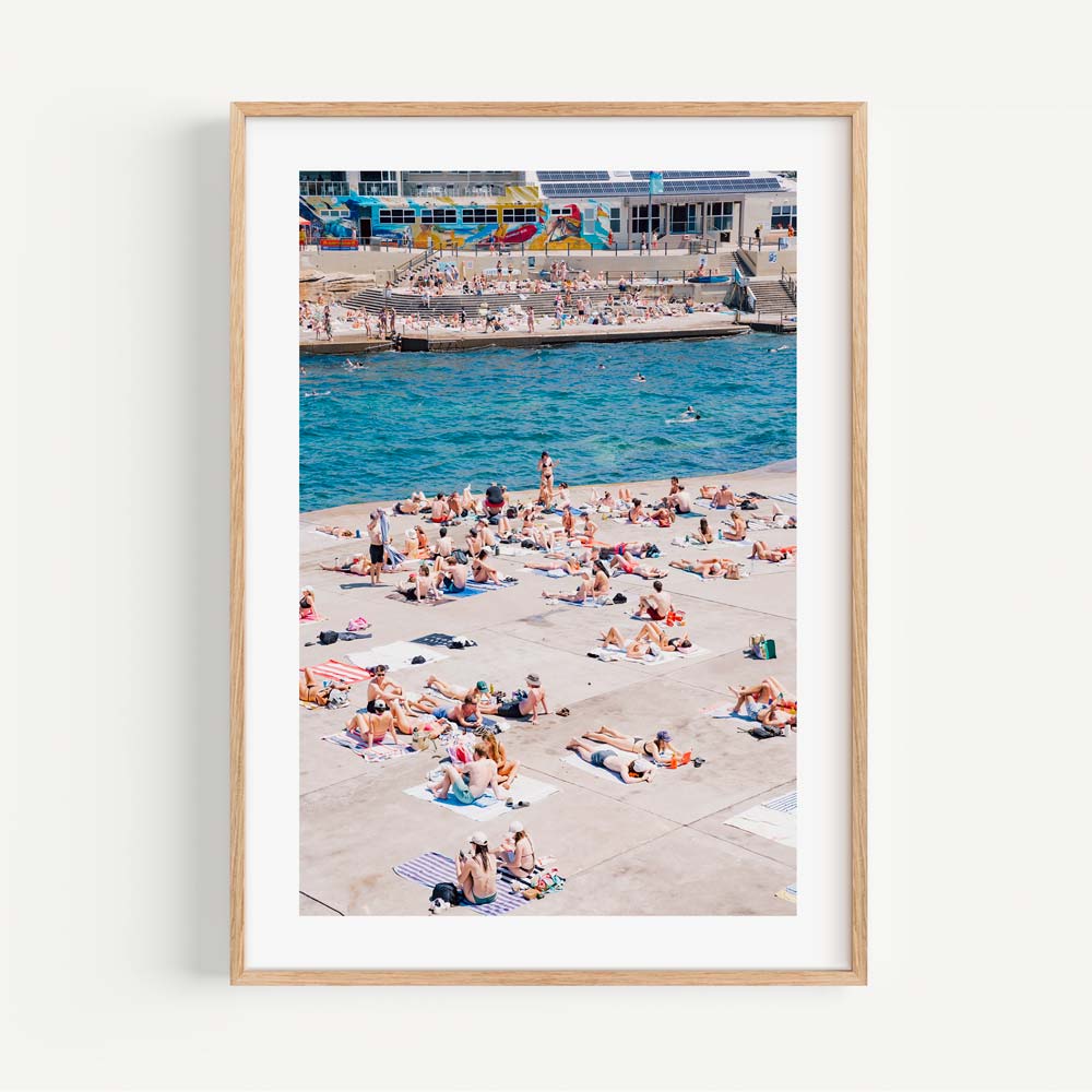 Relaxing beach ambiance in summer at Clovelly, Sydney: People basking in the sun and sea - Stylish wall art for your living space.