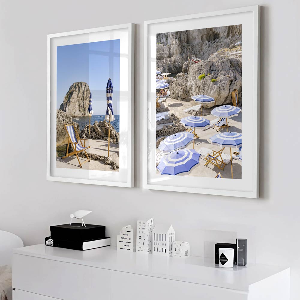 Mediterranean Retreat: La Fontelina, Capri, Italy, with sunbathing chairs and umbrellas framed by mountains, ideal for fine art prints 