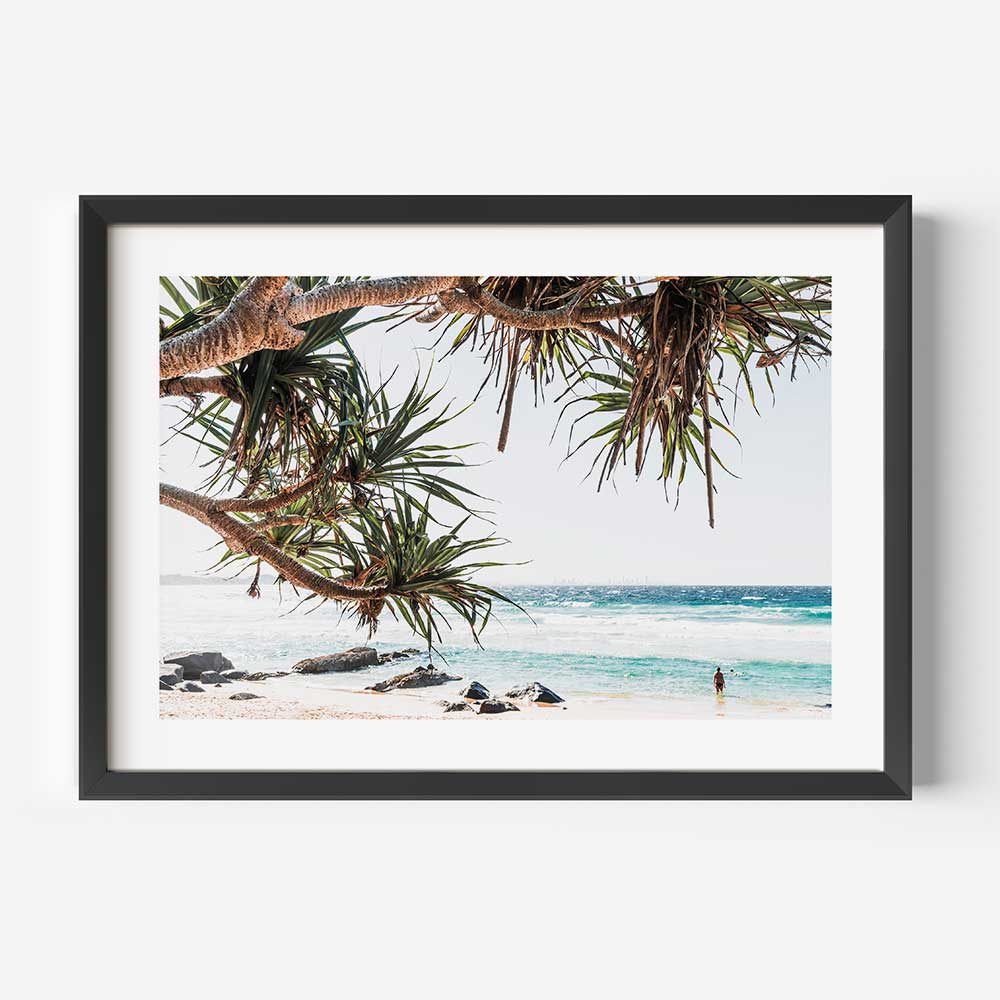 Desaturated coastal artwork with ocean blues and city skyline view of Rainbow Bay
