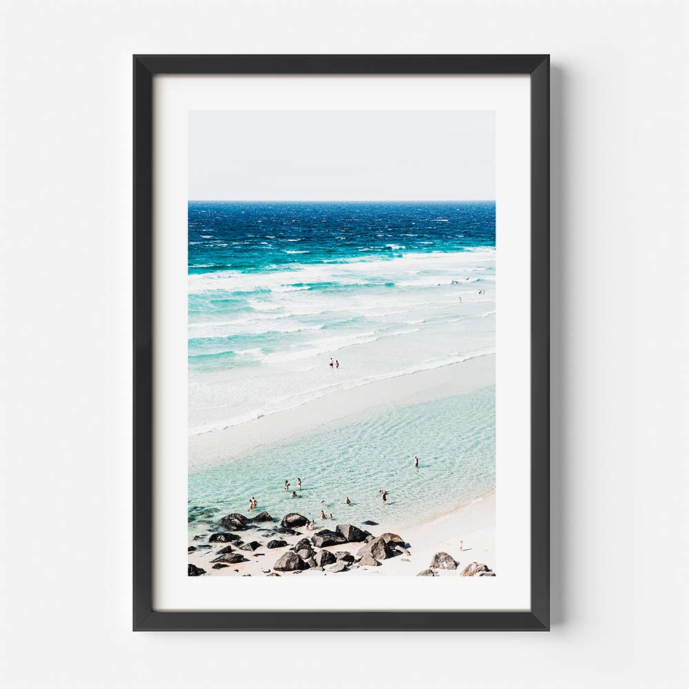 Unique coastal wall art with semi-aerial photography of Rainbow Bay beach and floating swimmers


