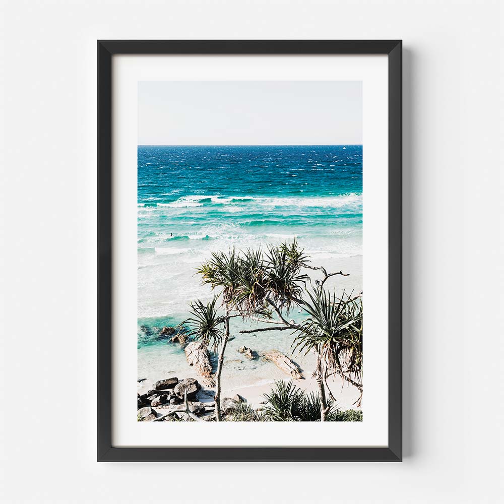 Aerial-style framed coastal wall art capturing shoreline rocks and soft ocean tones from Queensland

