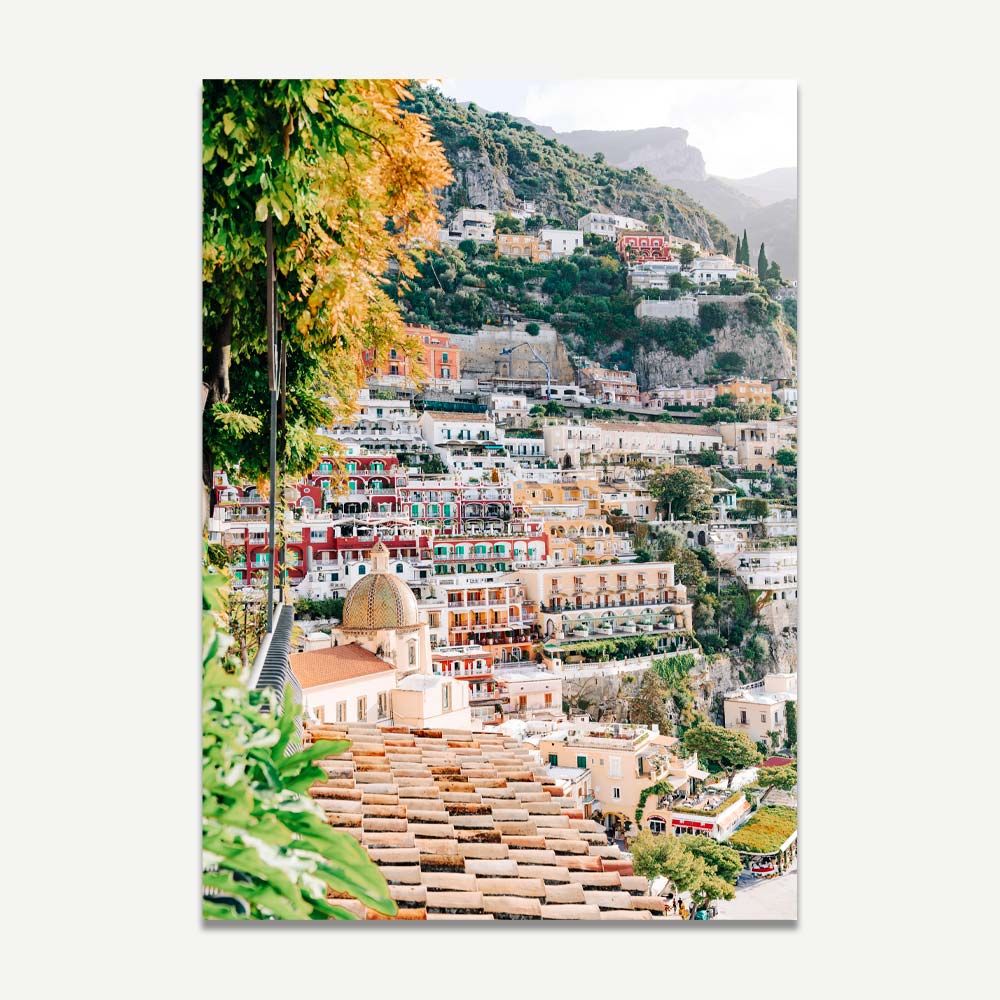 Positano wall art featuring cliffside buildings and dome after a morning shower – vibrant and serene Italian coastal decor.