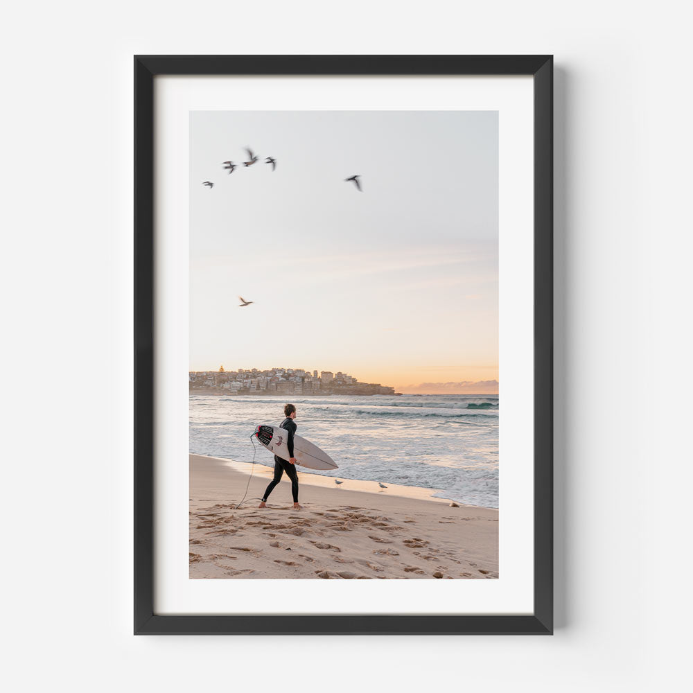 Dawn Rider: Silhouette of a surfer at Bondi Beach, embracing the tranquility and beauty of the ocean, perfect for wall decor.