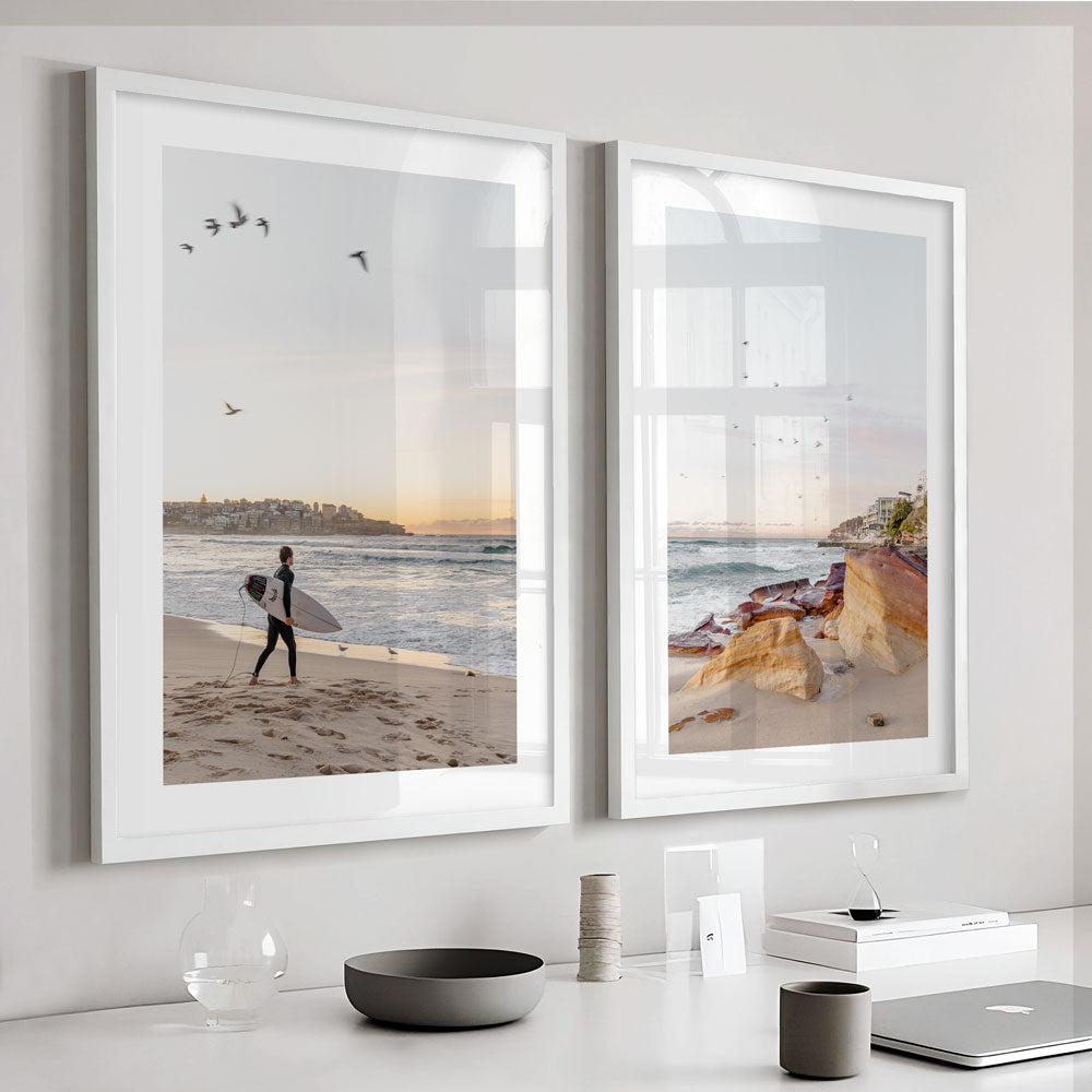 Surfing at Dawn: Scenic view of a lone surfer at Bondi Beach, perfect for wall art depicting coastal tranquility.