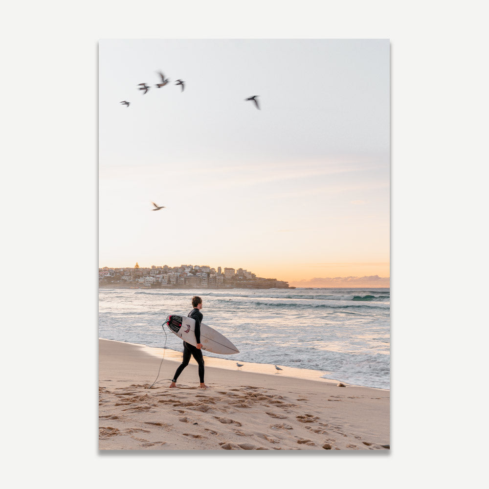 Bondi Beach Sunrise: Surfer enjoying the first light of day at Bondi Beach, reflecting the coastal lifestyle and natural beauty, ideal for enhancing your wall decor.