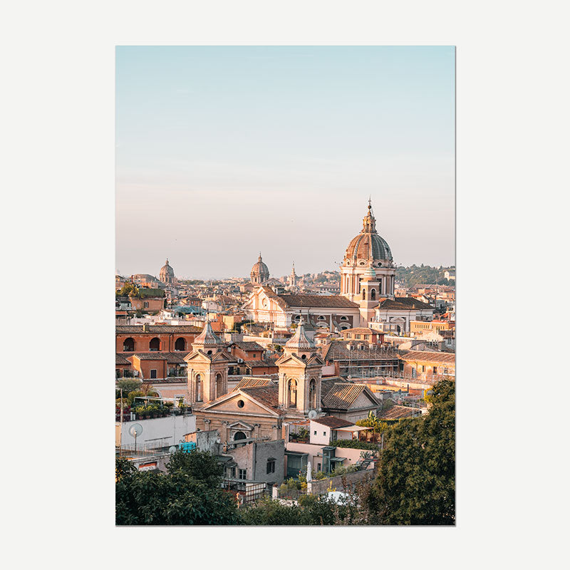 A vertical art print depicting a scenic view of Rome, featuring the prominent dome of Santa Maria del Popolo and other historic church domes and rooftops under a soft sky, shown with a white border.