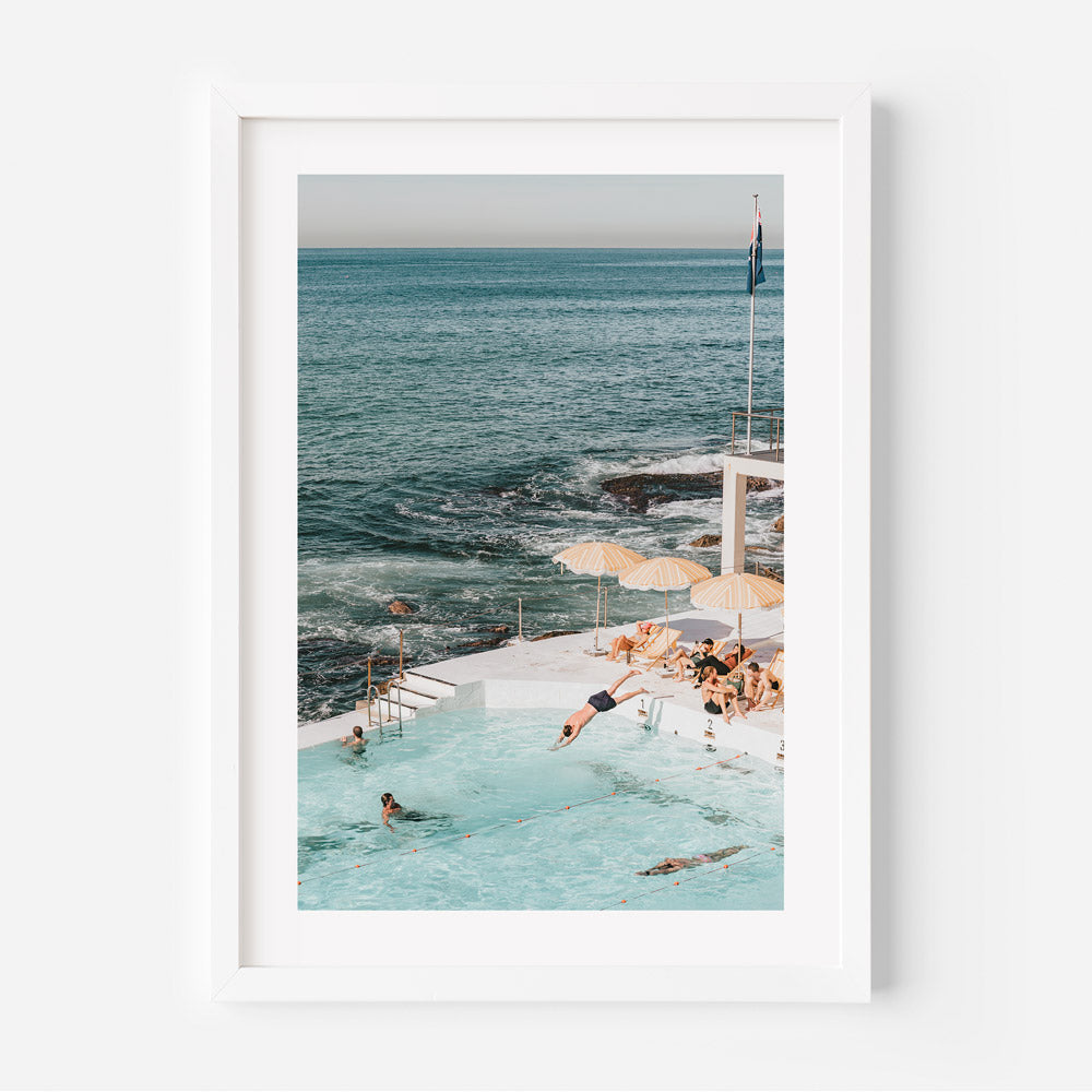 Bondi Icebergs wall art featuring vibrant yellow and white umbrellas, turquoise ocean hues, and modern wall decor.