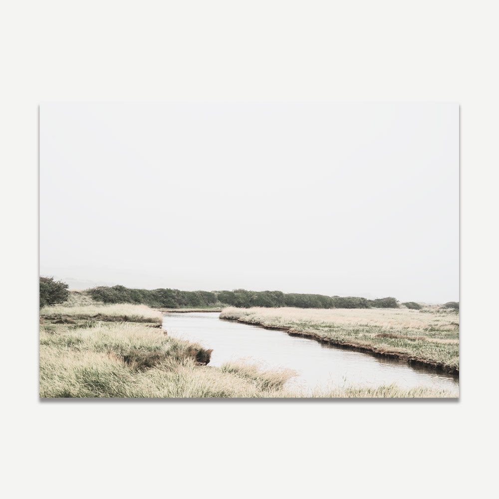 Transform your space with this exquisite wall art capturing the beauty of a river in the middle of a field in East Sussex, UK.